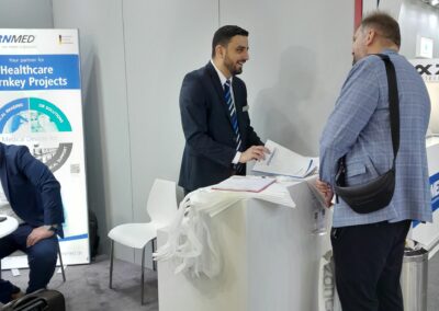 SternMed sales manager in talk with customer at Arab Health 2024 trade show